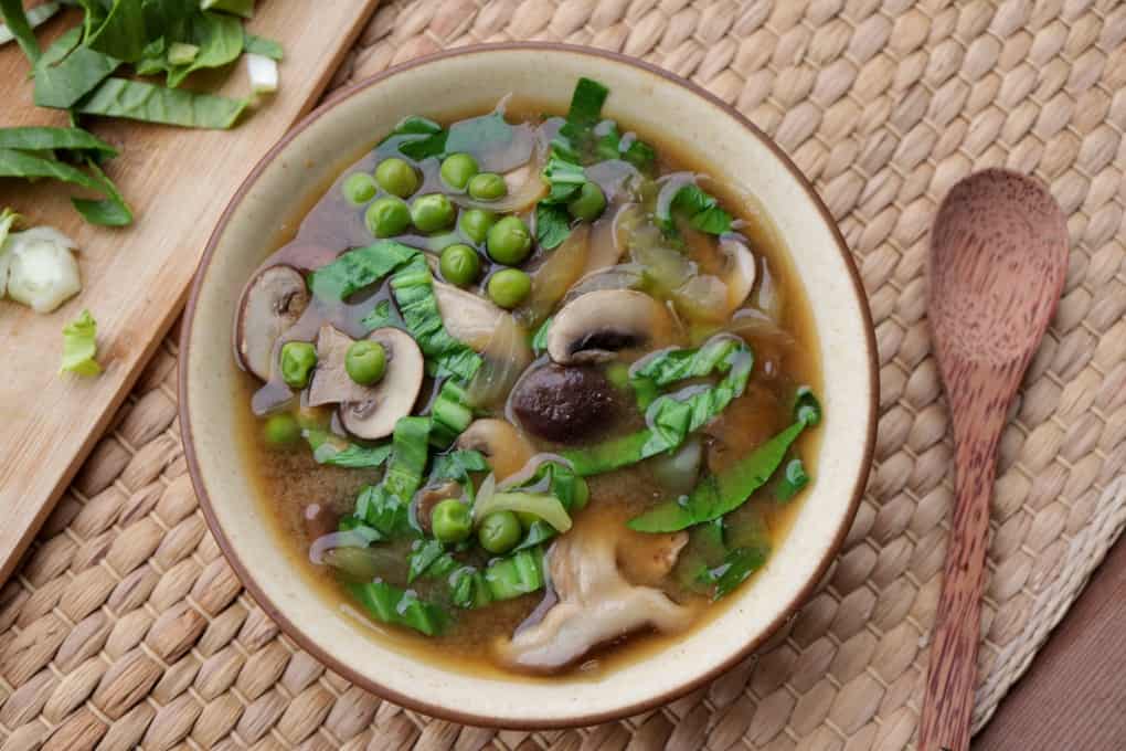 Vegan Miso Soup with Mushrooms, peas, onions and Pak ahoi (Shiro Miso) in a Bowl