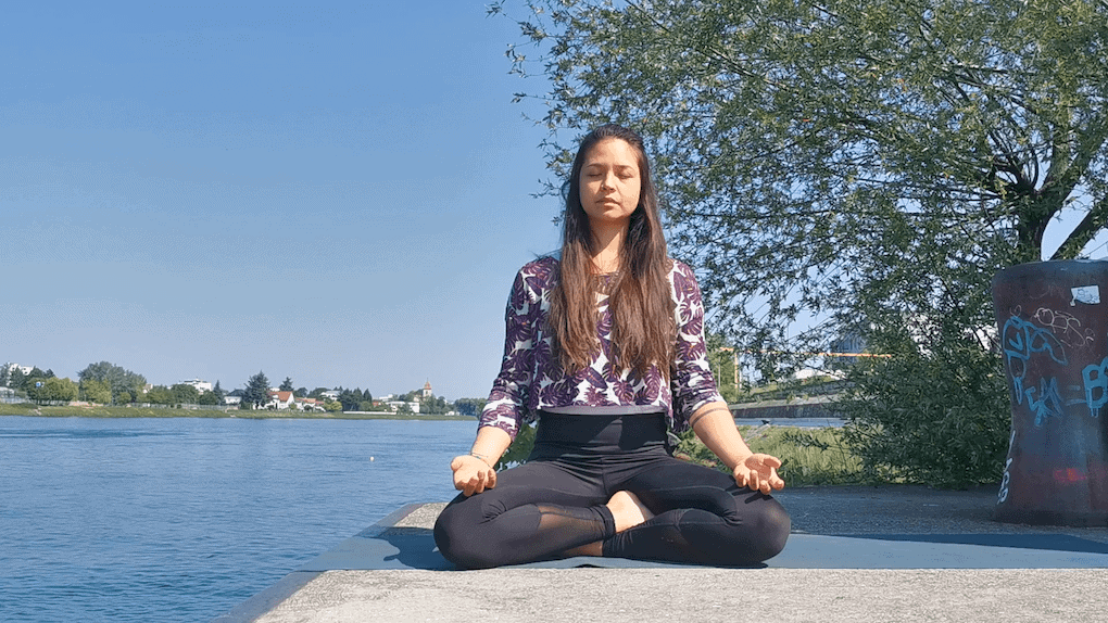 Nini from ligayayoga.com meditating next to the river